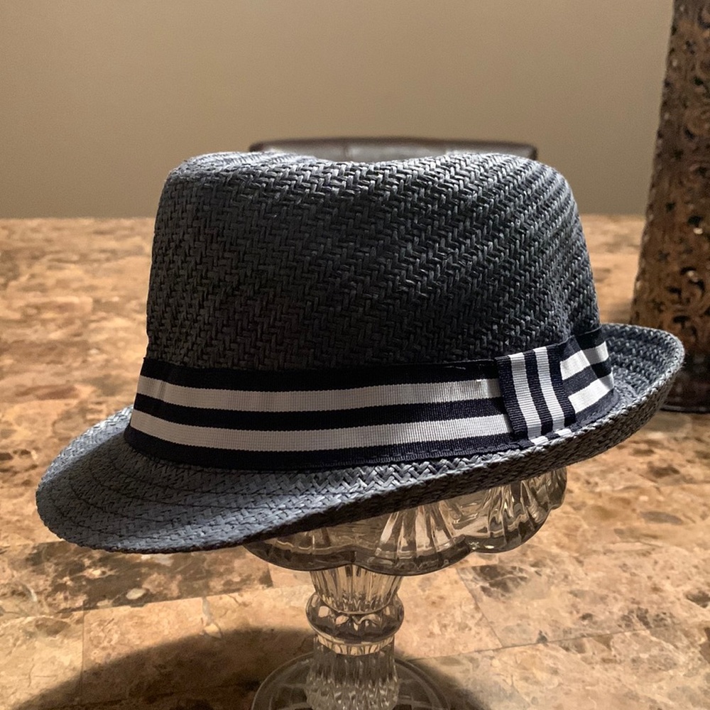 Blue boys hat with blue and white trim.